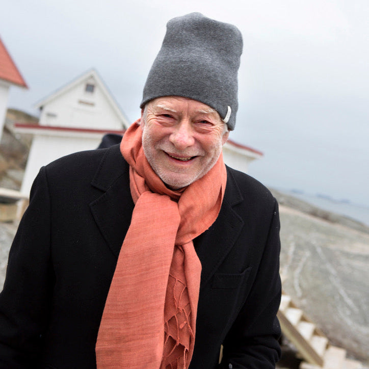 Man wearing a grey cashmere beanie and eri silk shawl
